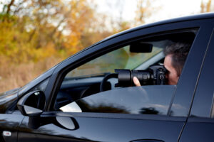 man in car photographing with professional camera 2026 03 17 07 12 46 utc